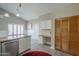 Eat-in kitchen offers wood-look floors, ample storage, built-in desk, and bright natural light at 717 E Temple St, Chandler, AZ 85225