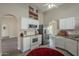 Bright kitchen with stainless steel appliances, white cabinetry, and a vaulted ceiling for a spacious feel at 717 E Temple St, Chandler, AZ 85225