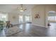 Inviting living room with wood-look flooring, vaulted ceilings, and bright windows with natural light at 717 E Temple St, Chandler, AZ 85225