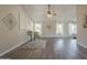 Spacious living room with wood-look flooring, vaulted ceilings, and bright windows with natural light at 717 E Temple St, Chandler, AZ 85225