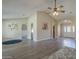 Open-concept living room with vaulted ceilings and modern flooring, creating a spacious and inviting atmosphere at 717 E Temple St, Chandler, AZ 85225