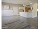 Bright open floorplan with white painted wainscoting and light gray plank flooring throughout the space at 717 E Temple St, Chandler, AZ 85225