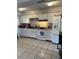 Bright kitchen featuring white cabinets, stainless steel appliances, and tile floor at 7808 W Clarendon Ave, Phoenix, AZ 85033