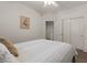 Bedroom featuring neutral colors, a comfortable bed, and a large sliding closet at 8237 W Alex Ave, Peoria, AZ 85382