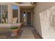 Welcoming front porch featuring decorative planter and door, enhancing the curb appeal of this lovely home at 8237 W Alex Ave, Peoria, AZ 85382