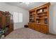 Home Office features a built-in bookcase and a vintage desk providing ample storage at 8237 W Alex Ave, Peoria, AZ 85382