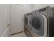 Laundry room features modern silver washer and dryer units for convenient cleaning at 8237 W Alex Ave, Peoria, AZ 85382