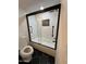 Updated bathroom with framed glass shower and unique tile design at 8625 E Belleview Pl # 1070, Scottsdale, AZ 85257