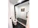 Modern bathroom boasts a glass-enclosed shower, black fixtures, and mosaic tile accents, creating a stylish space at 8625 E Belleview Pl # 1070, Scottsdale, AZ 85257