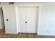 Modern white closet doors in a freshly painted and updated room at 8625 E Belleview Pl # 1070, Scottsdale, AZ 85257