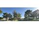 Beautifully landscaped community with mature trees, green lawns, and well-maintained residential buildings at 8625 E Belleview Pl # 1070, Scottsdale, AZ 85257