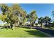 Well-maintained community with lush green spaces, mature trees, and charming residential buildings at 8625 E Belleview Pl # 1070, Scottsdale, AZ 85257