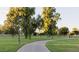 Picturesque community park featuring a walking path, lush greenery, and mature trees at 8625 E Belleview Pl # 1070, Scottsdale, AZ 85257