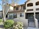 Charming townhome exterior with well-maintained landscaping and private gated entry at 8625 E Belleview Pl # 1070, Scottsdale, AZ 85257