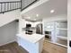 Modern kitchen featuring white cabinets, stainless steel appliances, and breakfast bar at 8625 E Belleview Pl # 1070, Scottsdale, AZ 85257