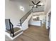 Open living space with high ceilings, modern staircase, and updated kitchen at 8625 E Belleview Pl # 1070, Scottsdale, AZ 85257