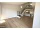 Spacious living area with a modern staircase and open access to the kitchen at 8625 E Belleview Pl # 1070, Scottsdale, AZ 85257