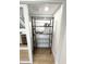 A walk-in pantry with shelving, great for storage in the kitchen area at 8625 E Belleview Pl # 1070, Scottsdale, AZ 85257