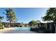 Community pool surrounded by lush landscaping and well-maintained residential buildings at 8625 E Belleview Pl # 1070, Scottsdale, AZ 85257