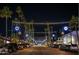 Festive downtown Scottsdale street view at night, adorned with lights and palm trees at 8625 E Belleview Pl # 1070, Scottsdale, AZ 85257