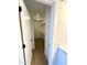 Walk-in closet features built-in shelving and storage space with light wood flooring at 8625 E Belleview Pl # 1070, Scottsdale, AZ 85257