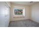 Bright bedroom with cozy window seat, neutral tones, and plush carpeting offering a serene retreat at 8765 W Custer Ln, Peoria, AZ 85381