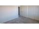 Neutral bedroom featuring soft gray carpet, ample closet space, and creates a calming environment at 8765 W Custer Ln, Peoria, AZ 85381