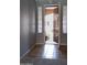 A welcoming entryway with tiled flooring and an open door revealing a glimpse of the exterior at 8765 W Custer Ln, Peoria, AZ 85381
