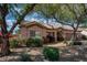 Charming single-story home features mature landscaping, tiled roof, and desert-friendly yard at 8765 W Custer Ln, Peoria, AZ 85381