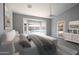 Serene main bedroom features a calming color palette, bay window and access to the backyard at 8765 W Custer Ln, Peoria, AZ 85381