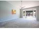 Spacious main bedroom showcasing a large bay window and modern ceiling fan at 8765 W Custer Ln, Peoria, AZ 85381