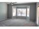 Serene main bedroom features neutral colors, carpeted floors, and large bay window at 8765 W Custer Ln, Peoria, AZ 85381