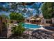 Sparkling private pool features desert landscaping and offers a tranquil backyard escape at 8765 W Custer Ln, Peoria, AZ 85381