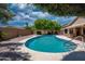 Refreshing private pool surrounded by desert landscaping, ideal for outdoor relaxation and entertainment at 8765 W Custer Ln, Peoria, AZ 85381