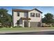 Charming two-story home features a tile roof, a two-car garage, and a well-maintained lawn at 9544 W Pinchot Ave, Phoenix, AZ 85037