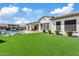 Gorgeous backyard with lush lawn, patio, and sparkling pool for ultimate relaxation at 10520 E Thorite Cir, Mesa, AZ 85212