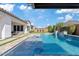 Tranquil backyard oasis featuring a sparkling pool and elegant covered patio at 10520 E Thorite Cir, Mesa, AZ 85212
