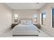Inviting bedroom showcases a plush bed, side tables and natural light from many windows at 10520 E Thorite Cir, Mesa, AZ 85212