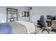 Bedroom features modern furniture, decor, and a large workstation at 10520 E Thorite Cir, Mesa, AZ 85212