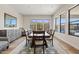Dining room with large windows overlooking the pool and a modern credenza at 10520 E Thorite Cir, Mesa, AZ 85212
