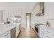 Modern kitchen featuring sleek countertops, stainless steel appliances, and wood-look flooring at 10520 E Thorite Cir, Mesa, AZ 85212