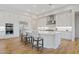 Well-lit kitchen with a large island, stainless steel appliances, and ample counter space at 10520 E Thorite Cir, Mesa, AZ 85212