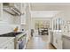 Gourmet kitchen featuring a stainless steel range hood and plenty of counter space at 10520 E Thorite Cir, Mesa, AZ 85212
