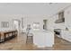 Open-concept kitchen with a large island, breakfast bar, and stainless steel appliances at 10520 E Thorite Cir, Mesa, AZ 85212