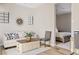 Inviting living room featuring hardwood floors, neutral tones, and seamless access to the adjacent bedroom at 10520 E Thorite Cir, Mesa, AZ 85212