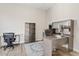 Functional home office with modern desk, ergonomic chair, and built-in storage for productivity at 10520 E Thorite Cir, Mesa, AZ 85212