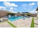 Beautiful backyard pool with hot tub, pristine stone, and pergola-covered lounge area at 10520 E Thorite Cir, Mesa, AZ 85212