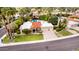 A charming property boasting a red tile roof, lush landscaping, and a convenient two-car garage at 10658 E Cinnabar Ave, Scottsdale, AZ 85258