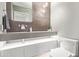 Modern bathroom with floating vanity, decorative lighting, and stylish fixtures at 10658 E Cinnabar Ave, Scottsdale, AZ 85258