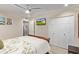 Bedroom showcasing ceiling fan, closet with doors, and modern decor at 10658 E Cinnabar Ave, Scottsdale, AZ 85258